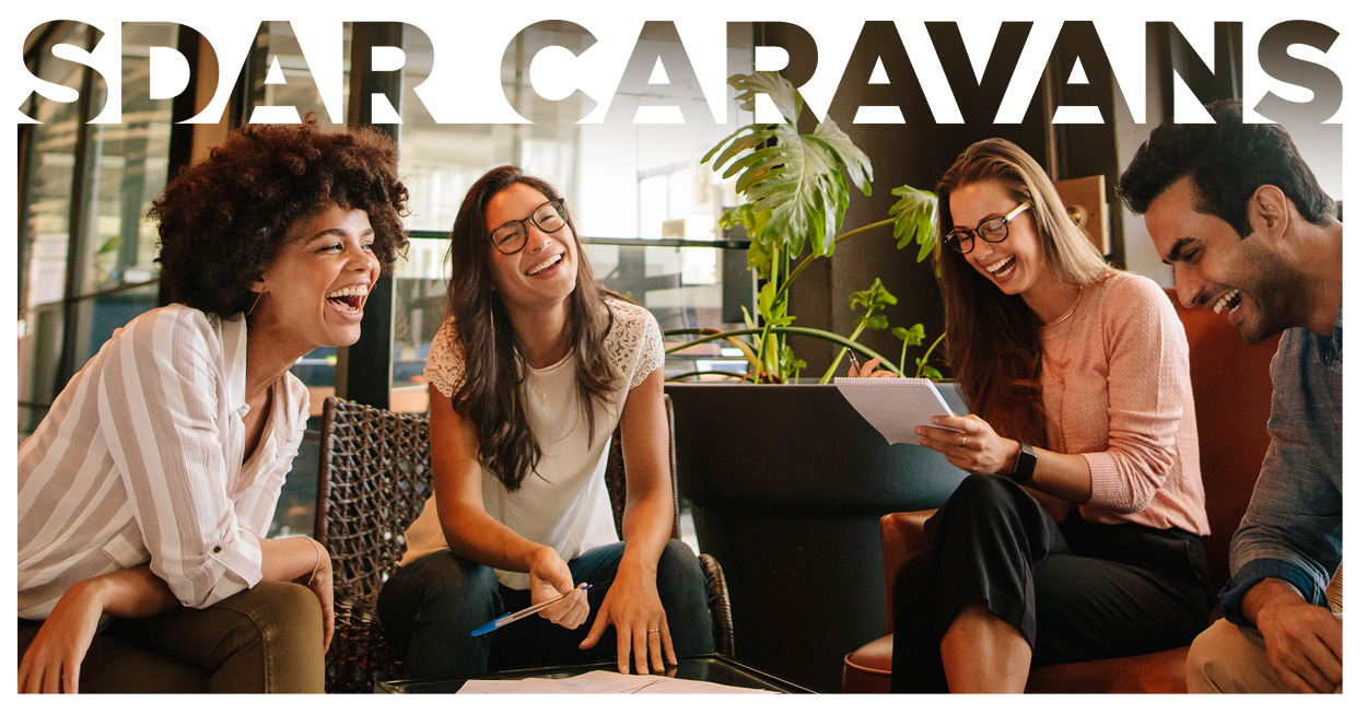 SDAR Caravan Image Display with four people laughing